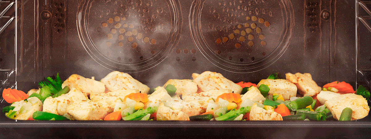 Tray of veg in a steam oven