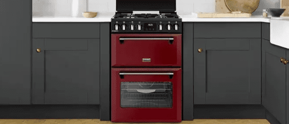 A red Stoves mini range cooker in a grey and white kitchen.