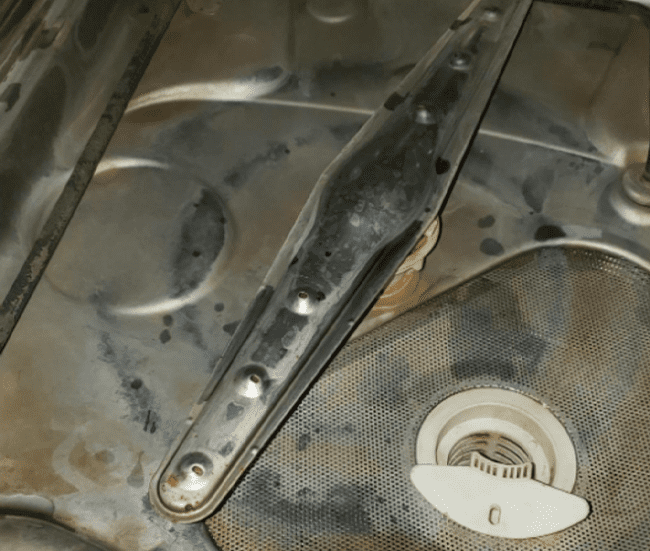 Brown residue on bottom of dishwasher