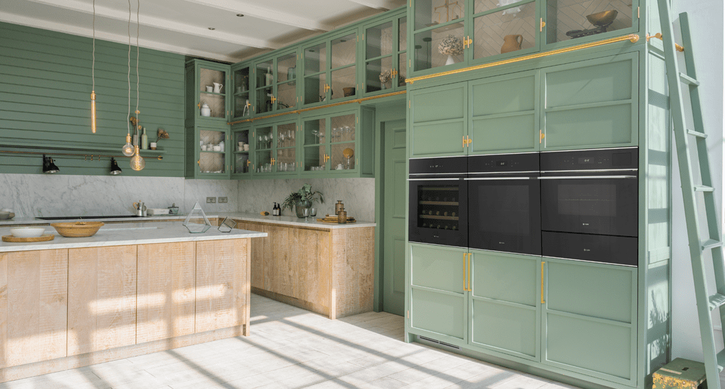 Image of a spacious mint green kitchen featuring Caple built in appliances.