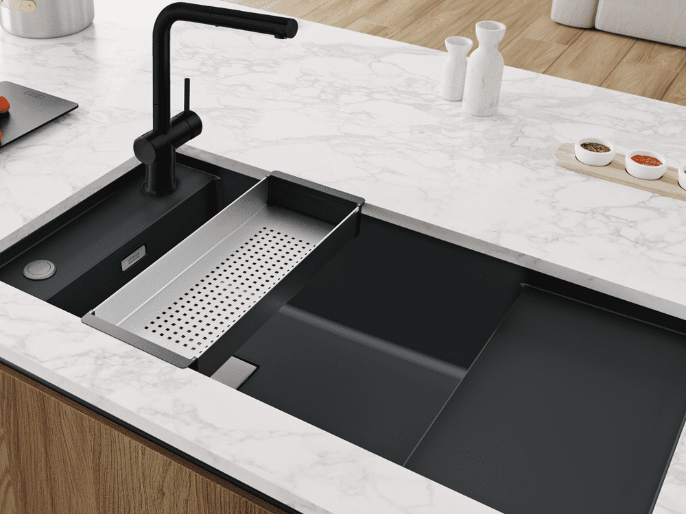 Franke fragranite sink in black, undermount into a white quartz worktop.