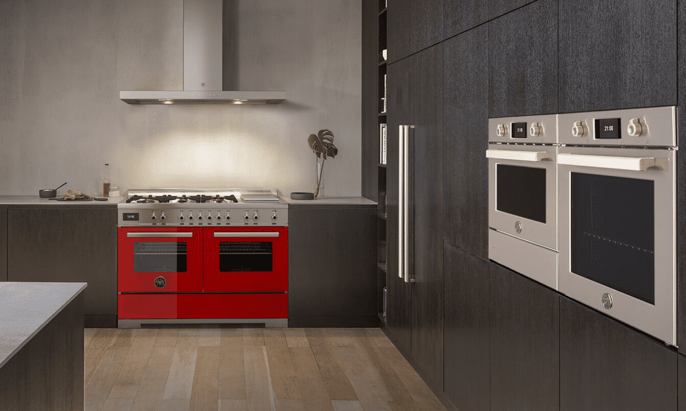 Image of a Bertazzoni Professional range cooker finished in red. The image also features built in cooking appliances from the Bertazzoni Professional Series.