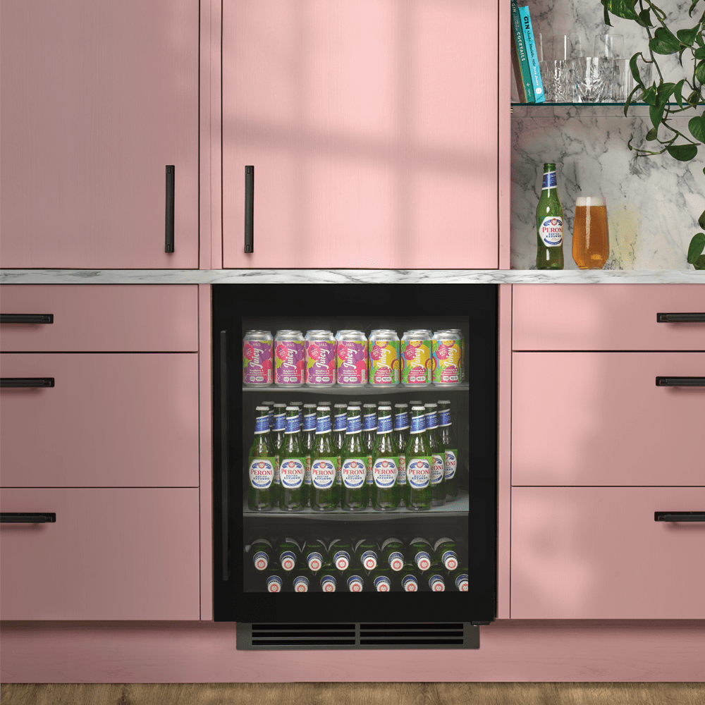 Image of a Caple wine cooler built into a rose pink coloured kitchen.