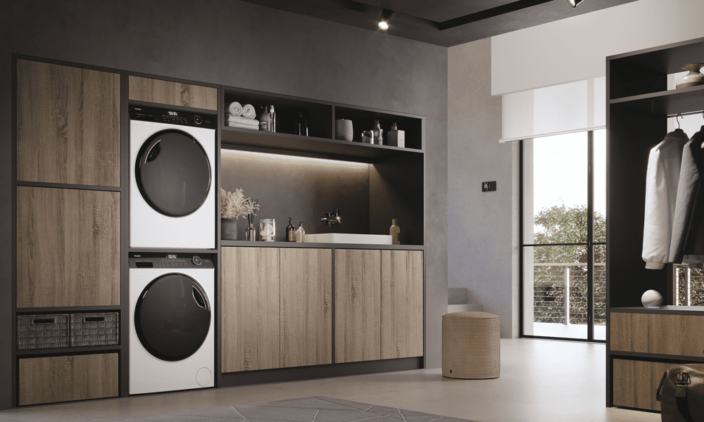 Two I-Pro series laundry appliances situated in a large spacious utility room featuring dark wooden cabinetry.