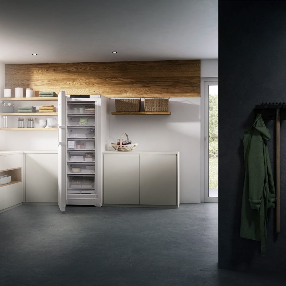 Liebherr full height fridge with it's door open so you can see the contents inside. The integrated fridge is fitted in a modern grey kitchen.