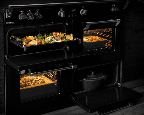 Image of a Black Stoves range cooker with all four cavities lit up and in use