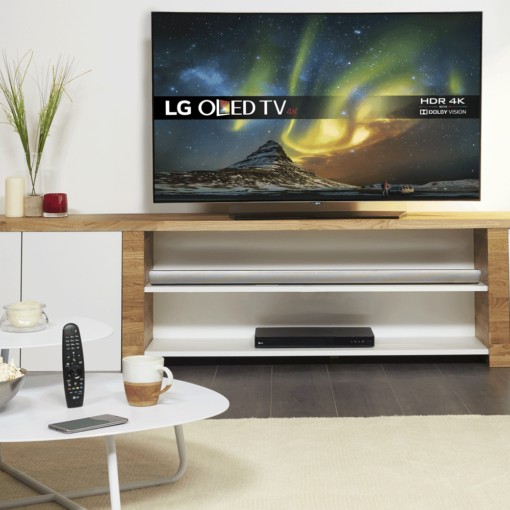 Close up of a living room featuring a large flatscreen LG TV.
