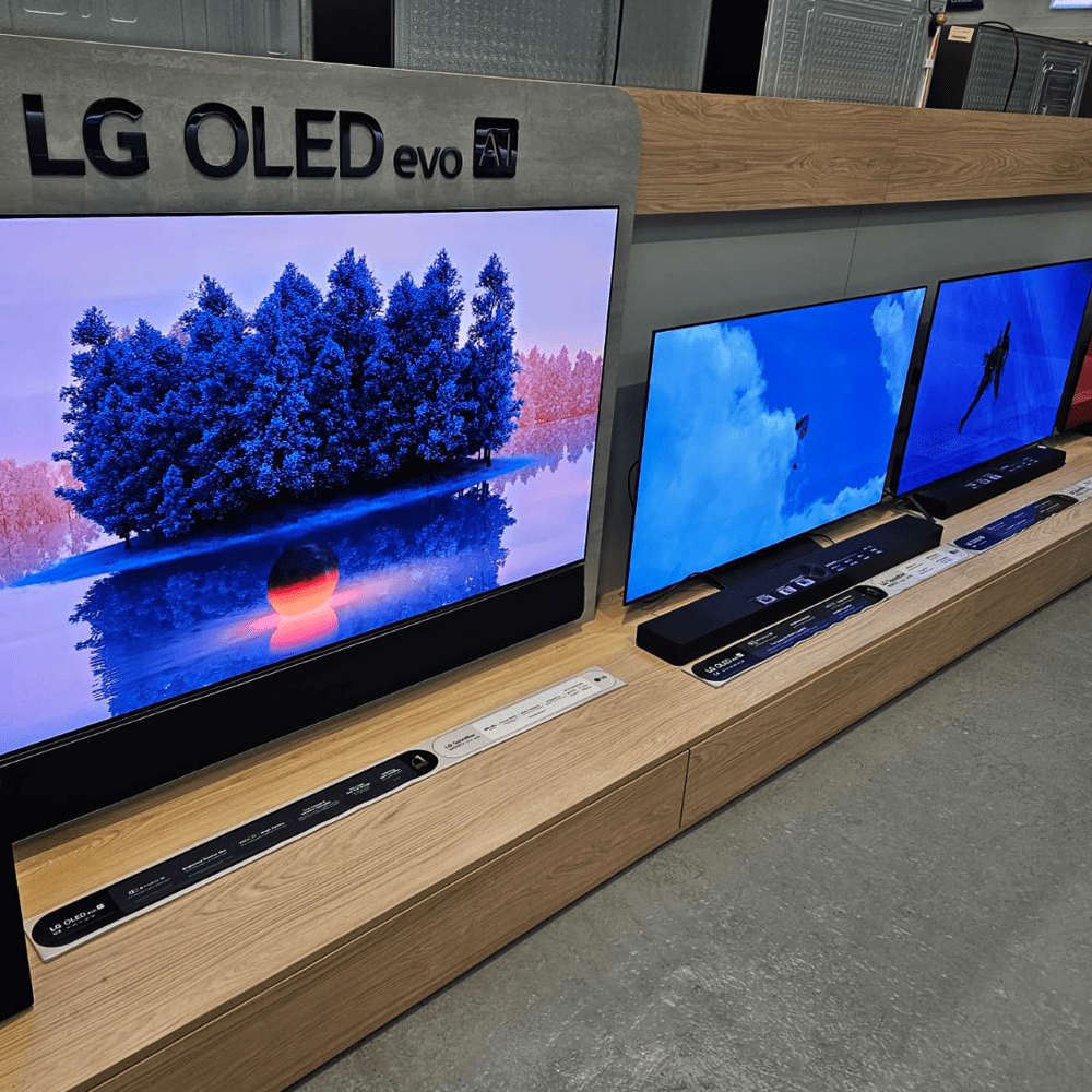 A row of LG TV's and soundbars on display in our showroom