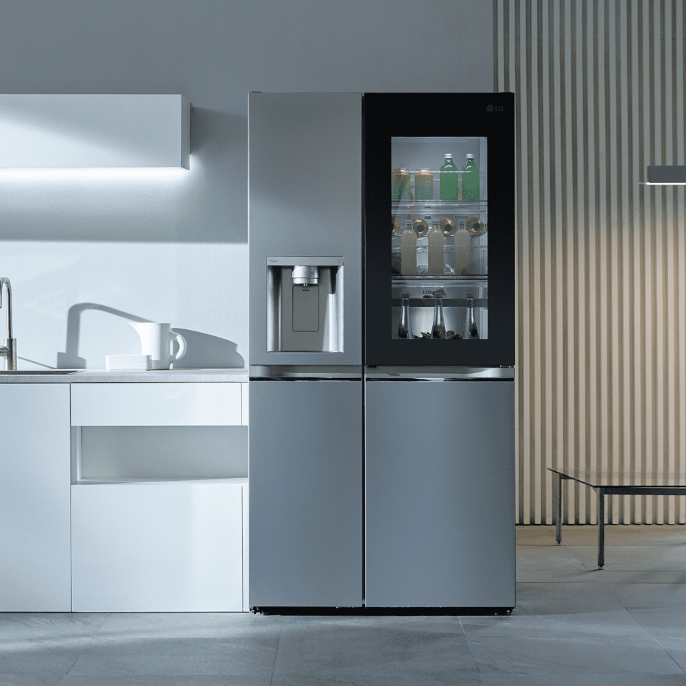 Image of an LG InstaView American style fridge freezer in stainless steel in a white and silver kitchen