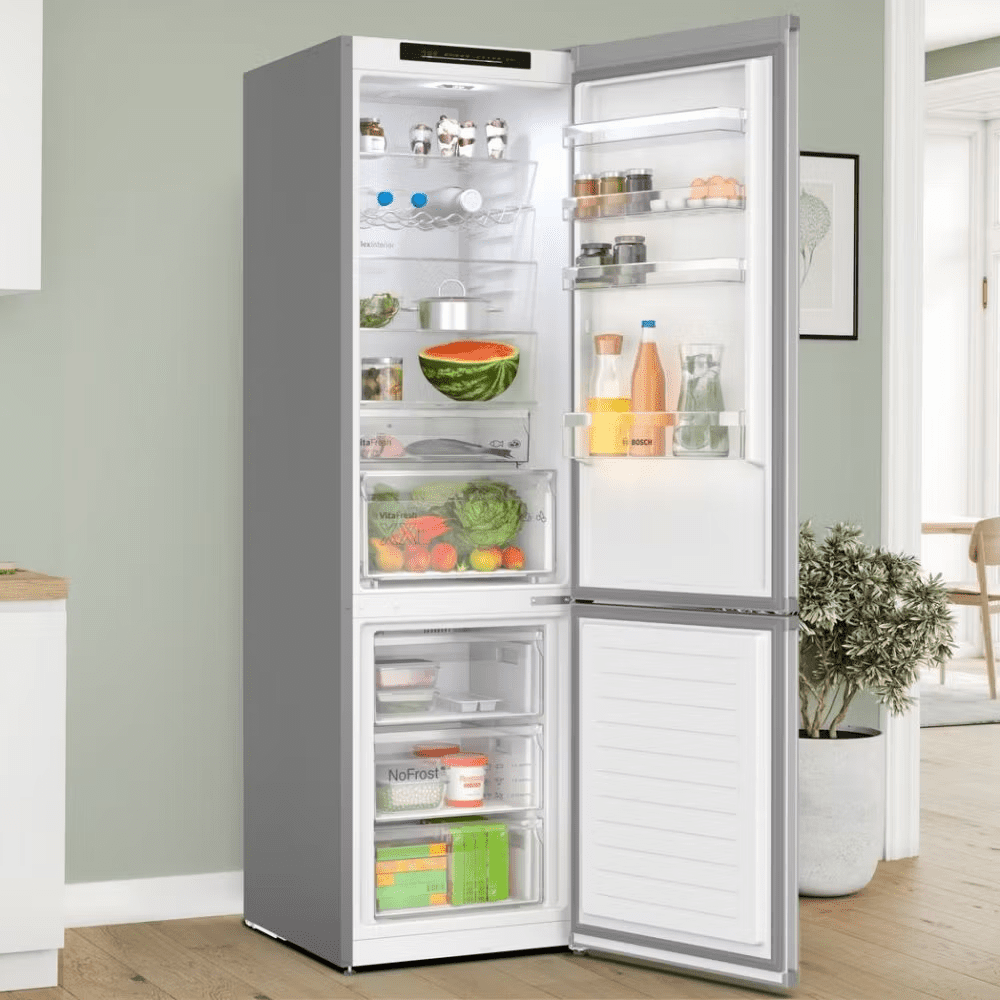 Close up of a Bosch fridge freezer with the door open featuring lots of fresh and brightly coloured food and drink.