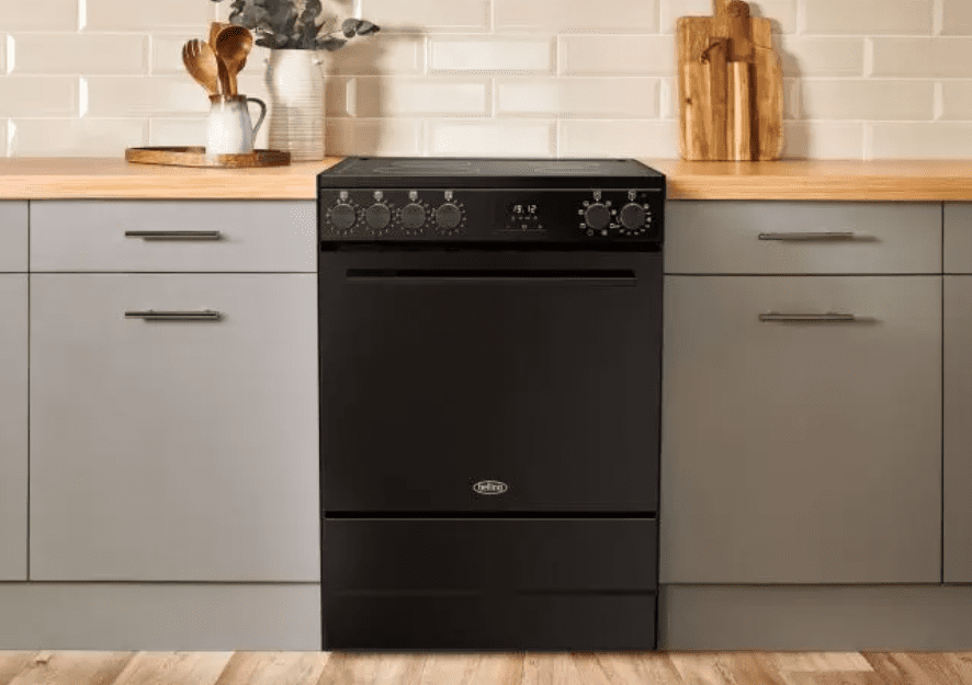 Belling freestanding cooker in black, fitted within a kitchen with grey cupboards